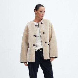 Fur-effect coat with appliqués